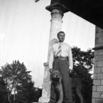 Szukalski on porch with dog